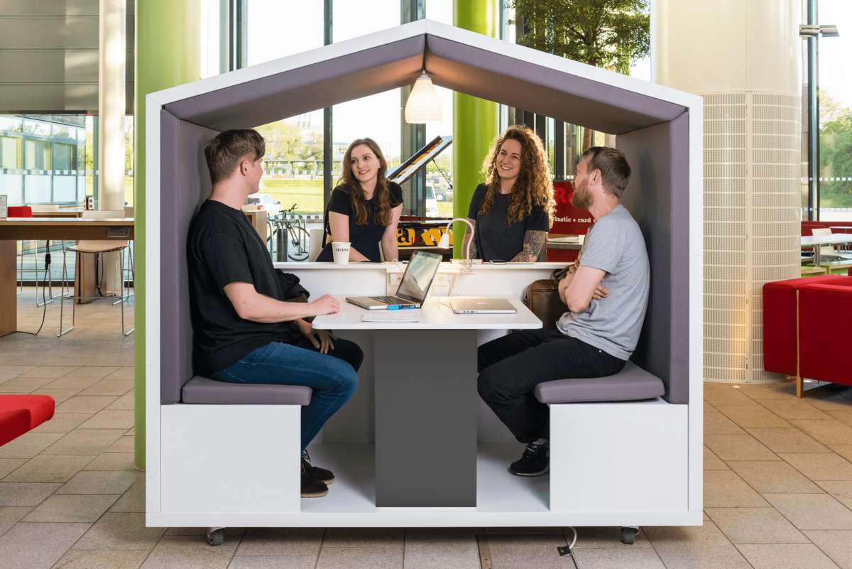 group of people using acoustic pod