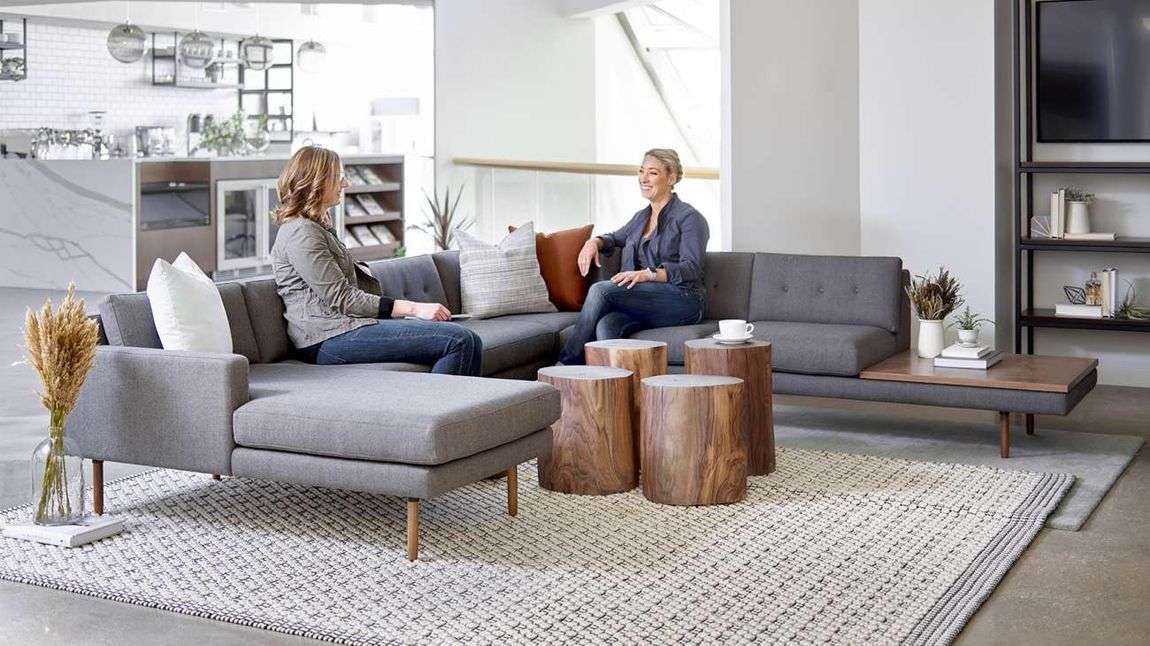 women having a conversation in a lounge