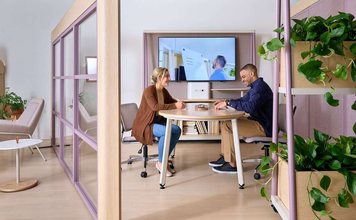 Employees collaborating in a hybrid office